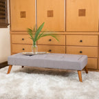 Pouffe en tissu capitonné