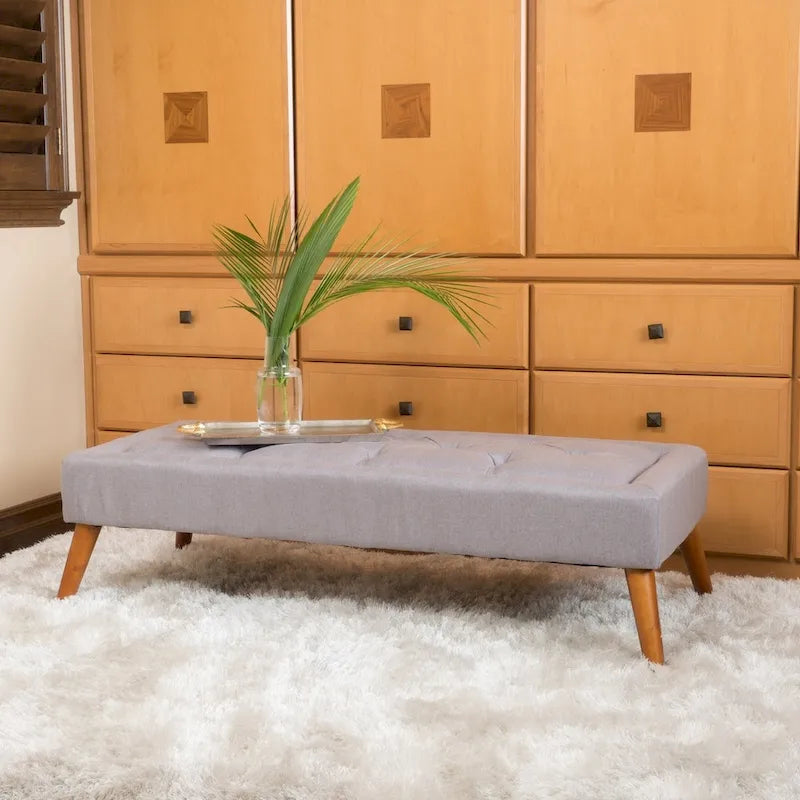Pouffe en tissu capitonné