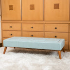 Pouffe en tissu capitonné