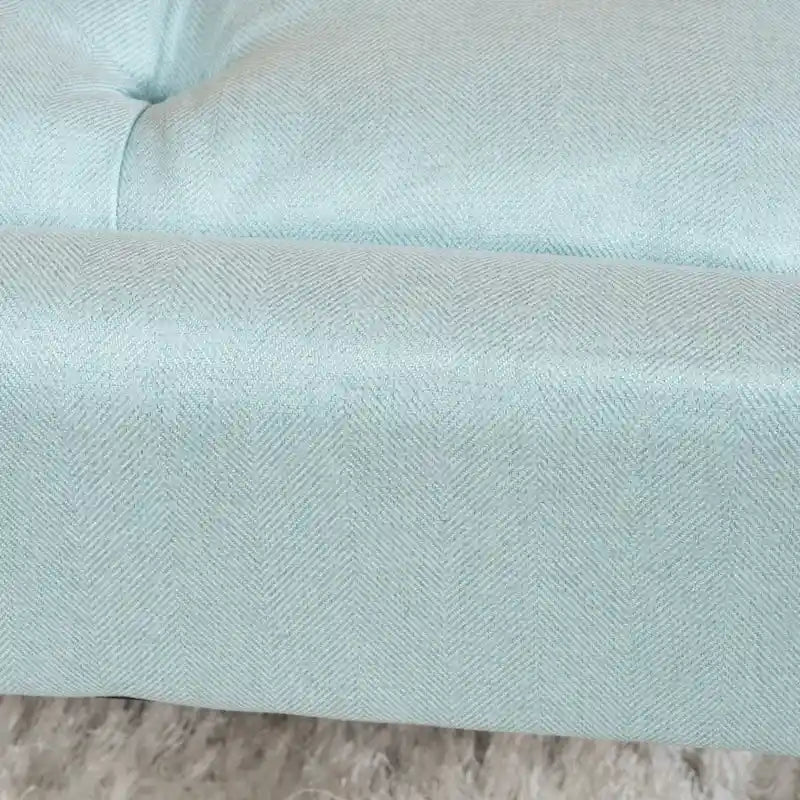 Pouffe en tissu capitonné