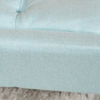 Pouffe en tissu capitonné