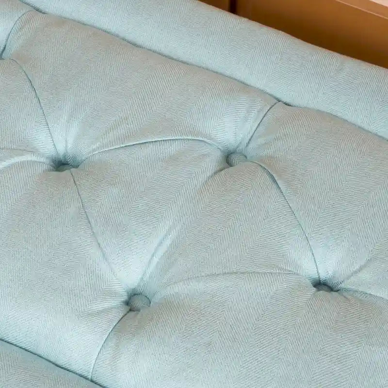 Pouffe en tissu capitonné