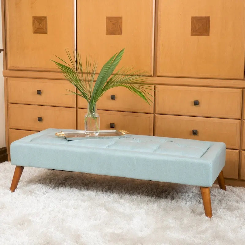 Pouffe en tissu capitonné