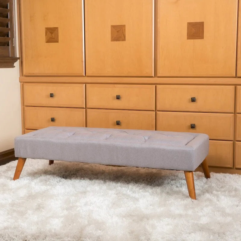 Pouffe en tissu capitonné