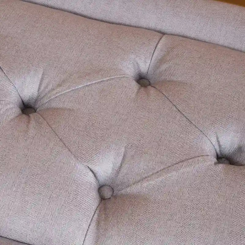 Pouffe en tissu capitonné