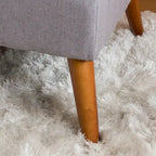 Pouffe en tissu capitonné