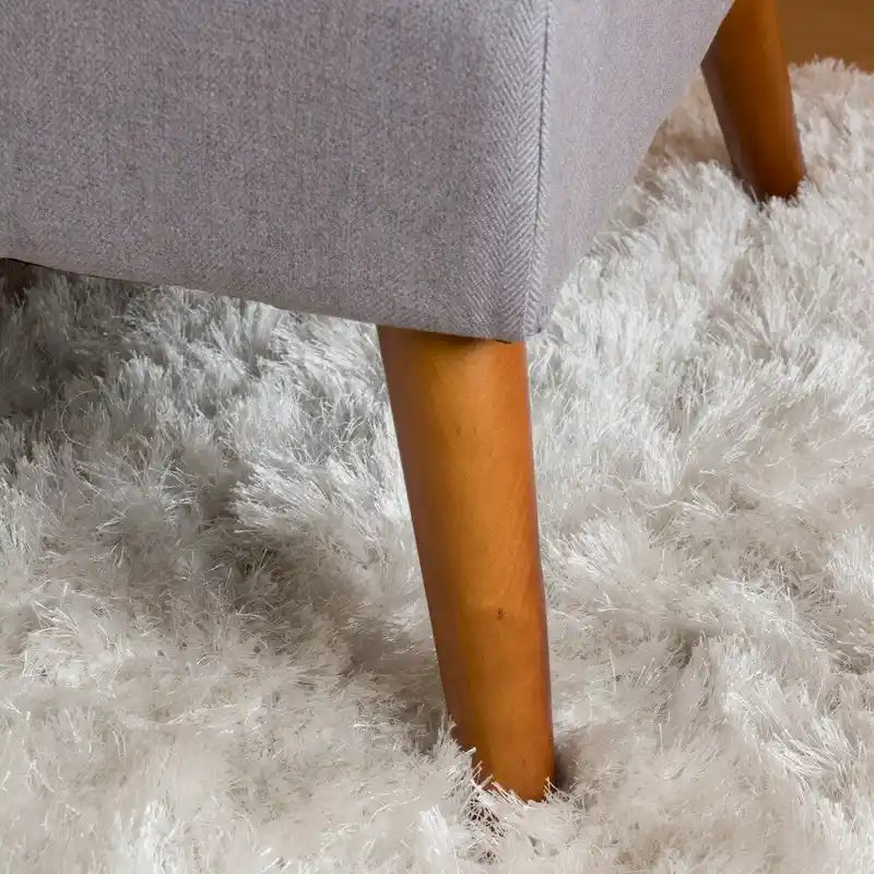 Pouffe en tissu capitonné