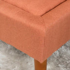Pouffe en tissu capitonné
