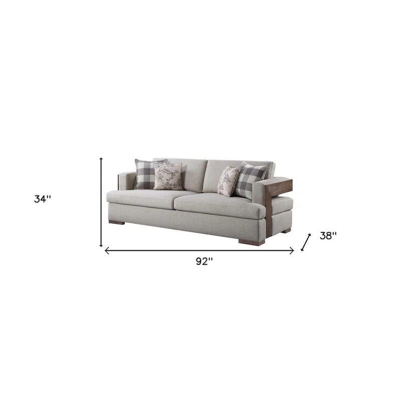 Canapé en tissu beige et coussins décoratifs avec pieds marron - 92
